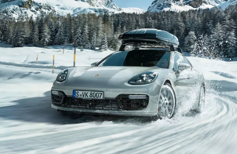 2020 Porsche Panamera driving through snow