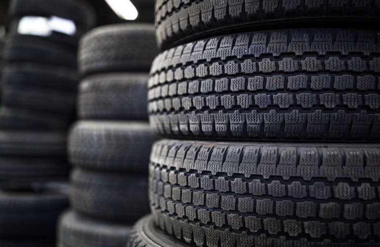 Tires stacked up at a tire store