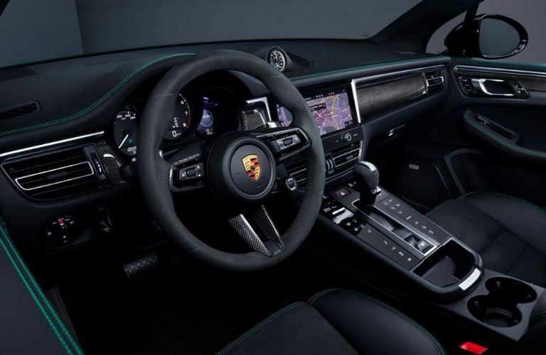 steering wheel and the interior seating of the 2022 Porsche Macan