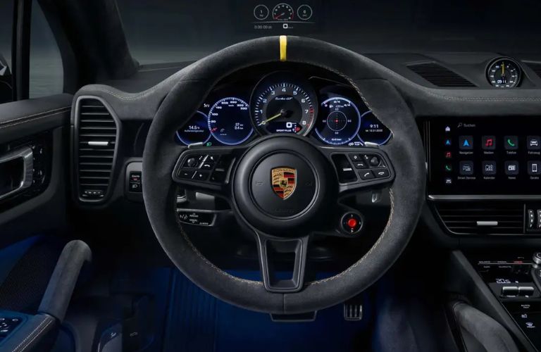 An image of the multi-function steering wheel of the 2023 Porsche Cayenne
